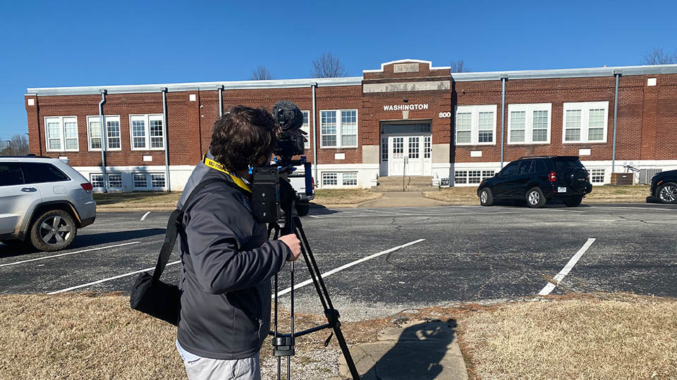 A photo of me filming B-Roll for the documentary '800 East Emma'